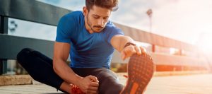 Young male jogger athlete training outdoors