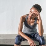 Tired fitness running woman sweating exhausted