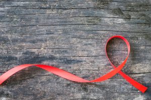Red ribbon awareness for World aids day concept
