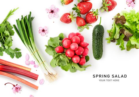 Vegetables, berries and cherry flowers spring salad photography isolated on white background